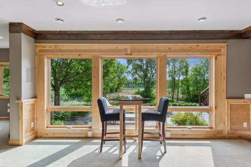 A view that will take your breath away every single day! These large, clear windows perfectly frame the stunning, panoramic views of lovely Lake Elmo, filling the home with natural beauty and a peaceful, vacation-like atmosphere year-round.