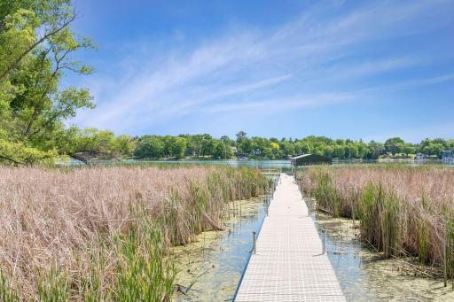 Lake life made easy! The property features a new, 220 ft. permanent "Boat Lift Boss" dock for effortless water access. Built to last with a heavy-duty aluminum frame and PVC uppers, it offers infinite wear with zero maintenance, plus a boat lift.