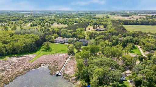 Another aerial view of the home with it's included dock & boat lift.