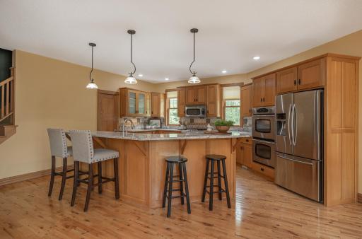 Large center island with granite counter tops