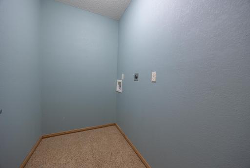 Laundry room with hook up in upper level of home