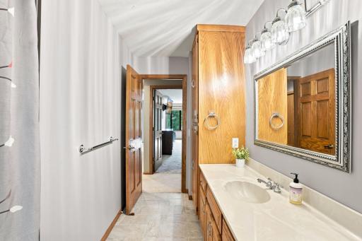Bathroom on upper level with built in storage
