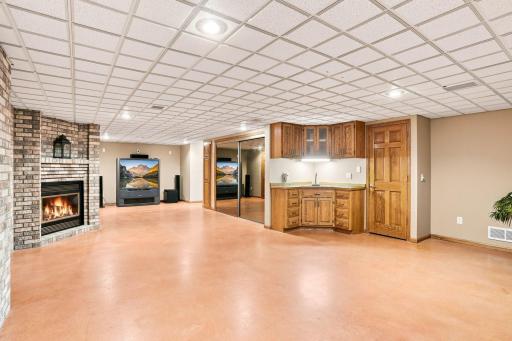 View of recreation room with built in wet bar area