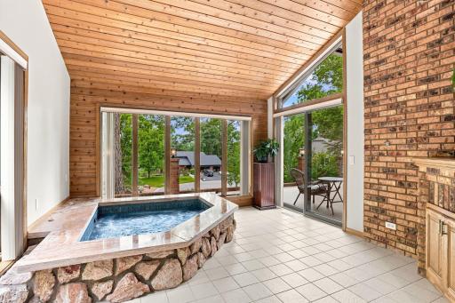 Hot tub and patio doors leading to the front porch