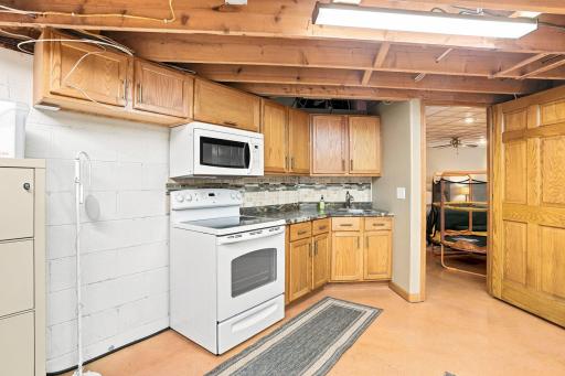 Storage room with built in kitchen that can be used for an extra living space