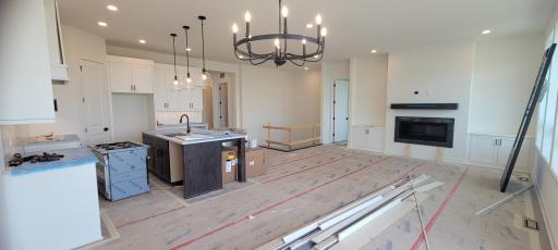 Thoughtfully designed kitchen and great room design with premium finishes and extensive custom cabinet storage space.