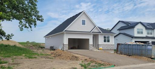 Spacious side yard presence with professionally maintained landscaping including an in-ground lawn irrigation system.