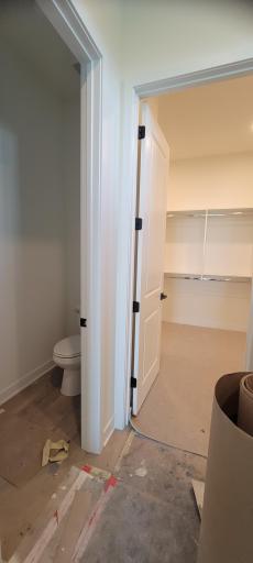 The private water closet provides perfectly balanced privacy when two people are getting ready at the same time each day.