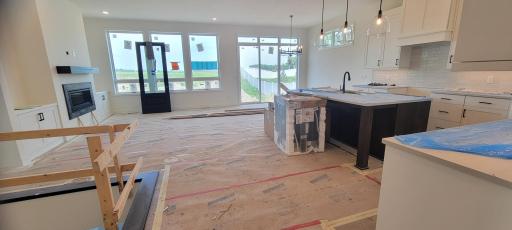 Natural light pours in through the stunning high-height window wall, showcasing the peaceful backyard views. The large dedicated sun-filled dining space can accommodate even the largest farmhouse table for holiday gatherings or everyday meals.