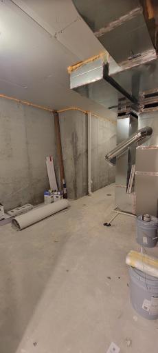 Whether you need extra storage for all of your special belongings or a safer space to retreat to during powerful summer storms, this utility/storage room in the lower level offers an ample uses.