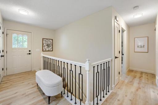 Step inside & be greeted by a beautifully remodeled foyer that sets the tone for the rest of the home. The bright, open entry showcases stunning luxury plank flooring, fresh neutral dÃ©cor, & updated millwork that create a warm yet sophisticated feel