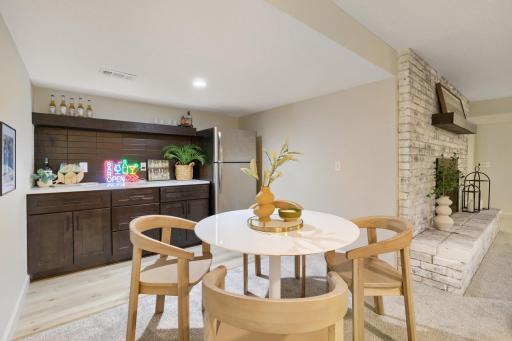 ENJOY this newly added bar area. Whether serving cocktails, setting up a coffee station, or creating the perfect snack bar for movie nights, this versatile space is designed to accommodate every occasion & transforms the lower level