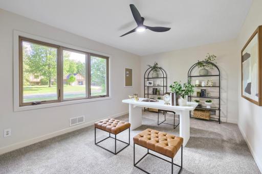 Currently staged as a stylish home office, this versatile room easily functions as a spacious bedroom, guest suite, or flex space to fit your lifestyle. A large picture window fills the room with natural light creating a bright inviting atmosphere