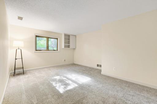 There are two generously sized lower-level bedrooms that offer exceptional flexibility and comfort, making them ideal for family members, guests, or a dedicated home office.