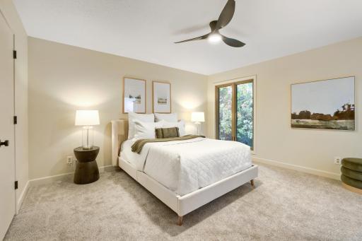 Escape to the comfort of this beautifully remodeled primary suite, thoughtfully designed to create a peaceful and relaxing retreat. The spacious bedroom offers ample room for a king-size furniture arrangement while maintaining an open and airy feel.