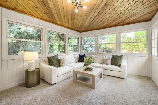 This inviting sunroom offers the perfect retreat to relax and enjoy the beauty of every season. Surrounded by walls of windows the space is filled with natural light and a peaceful connection to the outdoors.