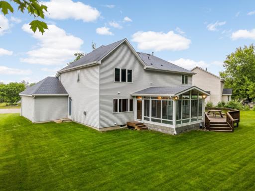 Large flat backyard with sunny 3+ season porch and custom deck