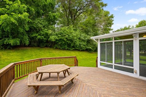 Custom deck and 3+ season porch offer wonderful outdoor living options