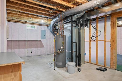 Mechanical room with storage; rough in for bathroom