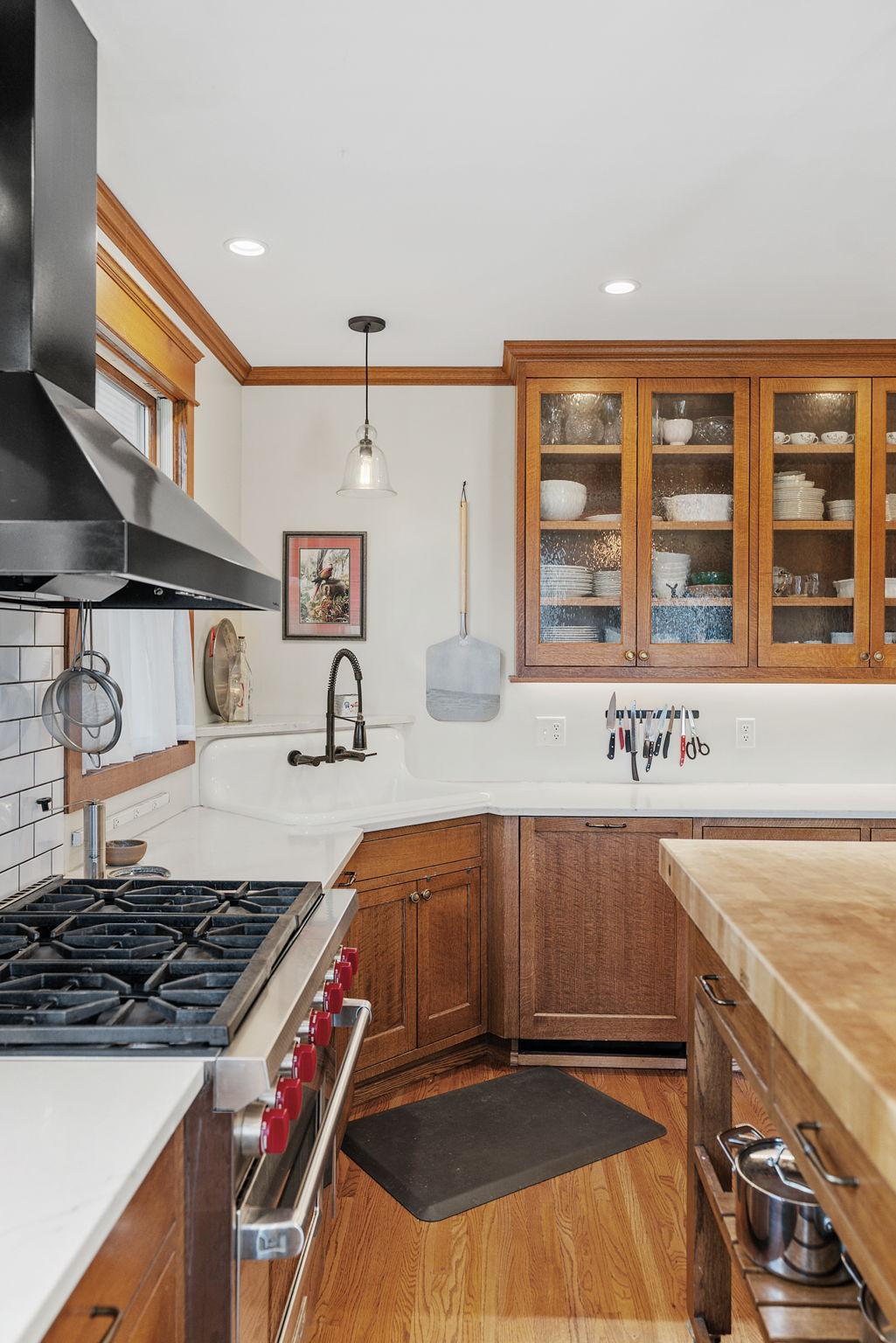 Glass door cabinets highlight the beauty of the kitchen
