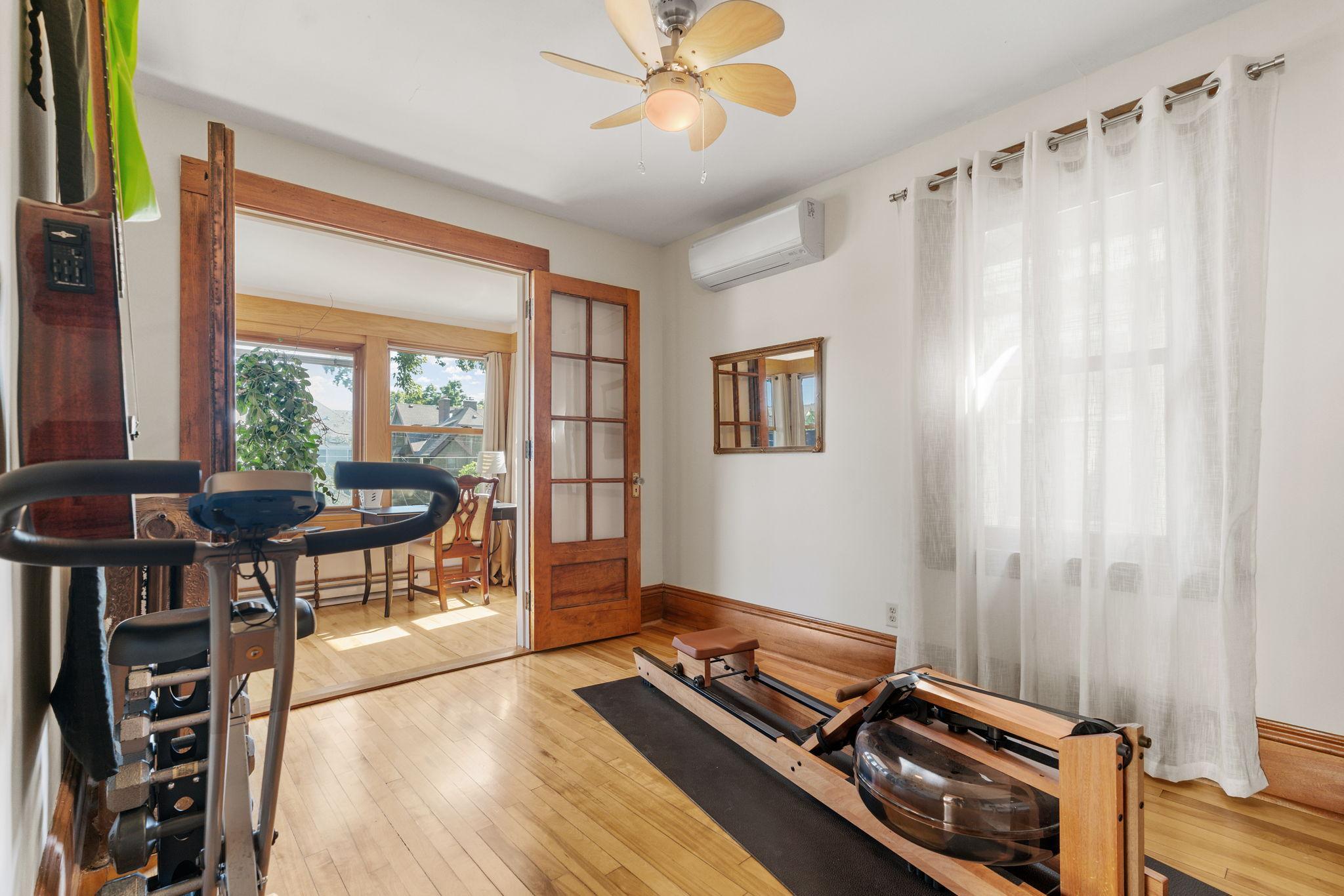 Third upper level bedroom currently used as workout space