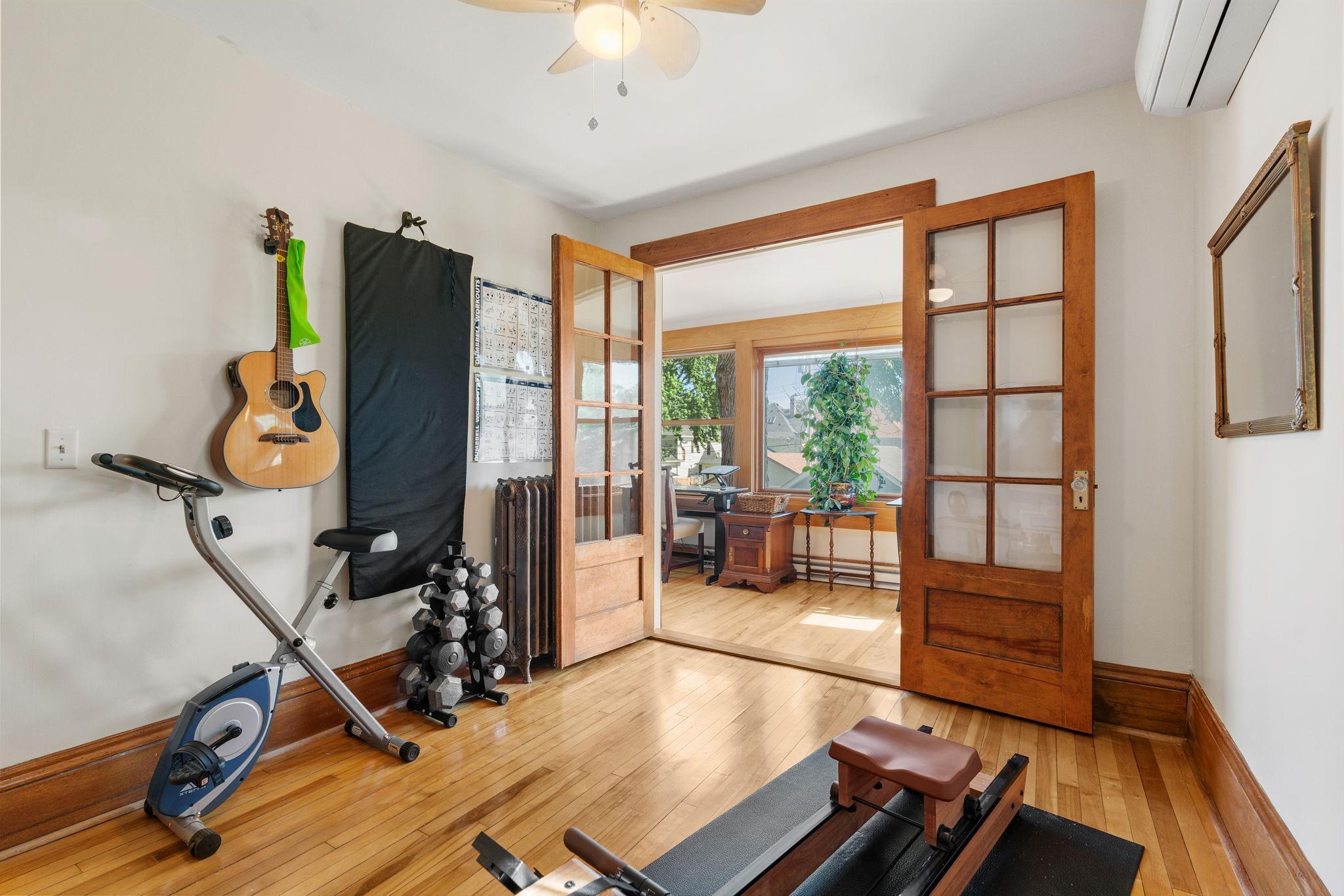 French doors lead to upper level porch off of bedroom