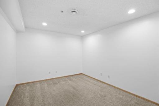 Additional living space ideal for a home office, gym, or guest area in the lower level