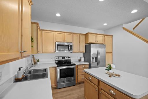 Kitchen island with pull out drawers, SS appliances - new range in 2022, fridge in 2019.