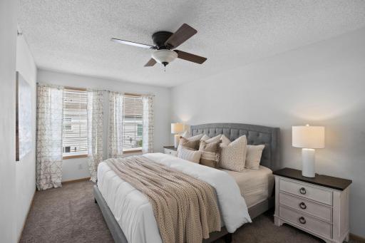 Spacious primary bedroom with en-suite. Great natural night from the two large windows. View of pond