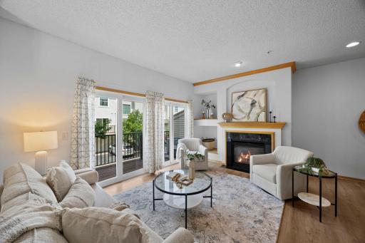 Durable luxury vinyl plank floors throughout the main level install in 2022. Spacious balcony with full wall of windows in living room