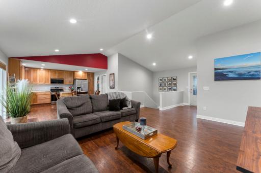 This view from the living room area shows the entry and the steps to the lower level.