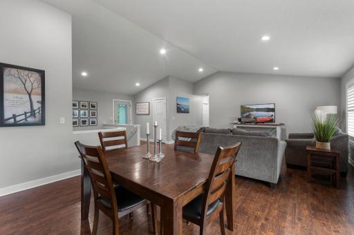 The dining space in this open concept floor plan flows effortlessly from the living space and to the kitchen