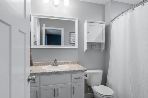 Primary bathroom with full tub and shower