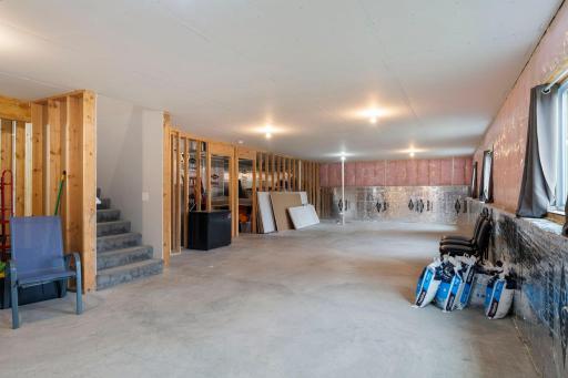 The unfinished lower level has so many options , you can finish it to your liking with all of this space!