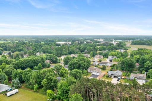 Nestled in a neighborhood with mature trees and green space