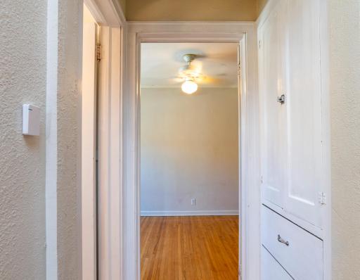 From kitchen, looking down hall to bedroom