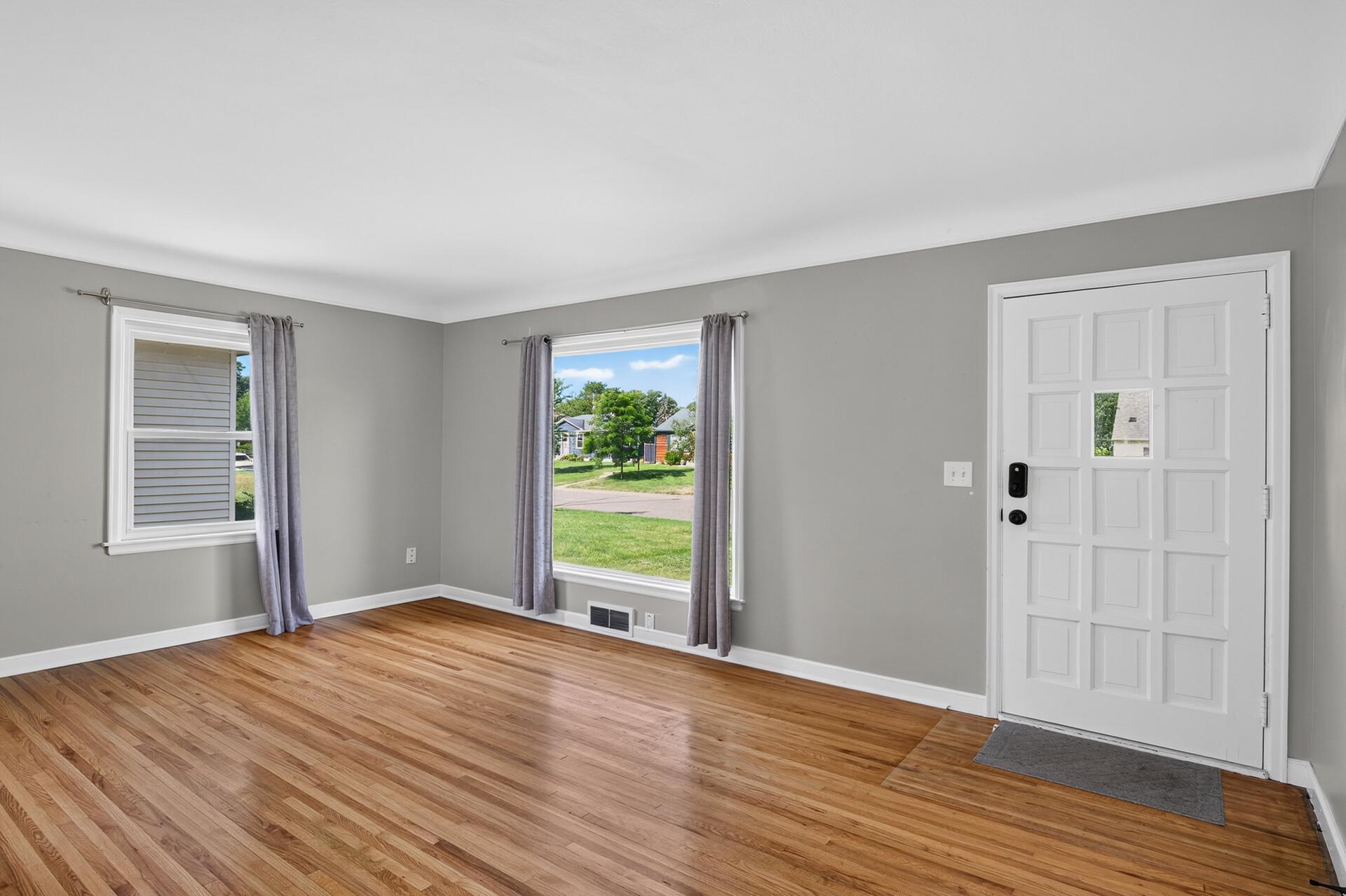 Well lit Living Room with Picture window and side window