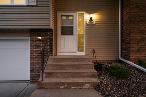 Sidelight and storm door and gutters on exterior