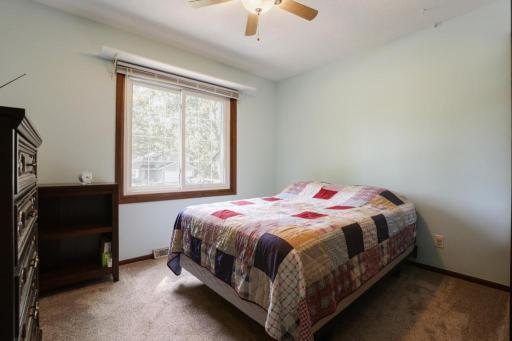 Bedroom #3 - West facing with ceiling fan and the window treatments stay in all of the rooms.