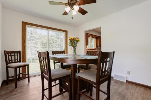 Dining Room with a newer patio door. (Patio door locked for safety.) Potential to add a spacious deck to the backyard.