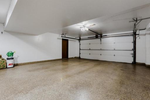 The attached tuck under garage is insulated and sheet-rocked along with a finished floor. Separate door to the 3rd garage stall not pictured.
