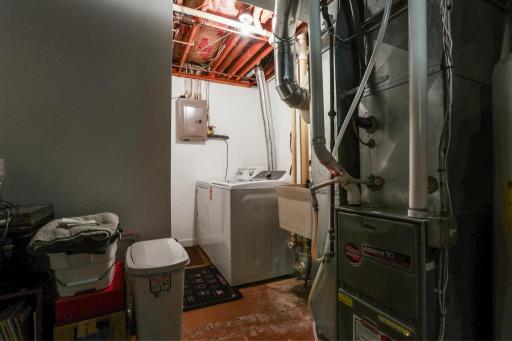 Lower level laundry and mechanical room. Electrical, appliances and HVAC have all been updated over the years. Washer is brand new 2026!