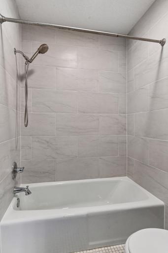 Upper level Full Bathroom with remodeled/updated Shower.
