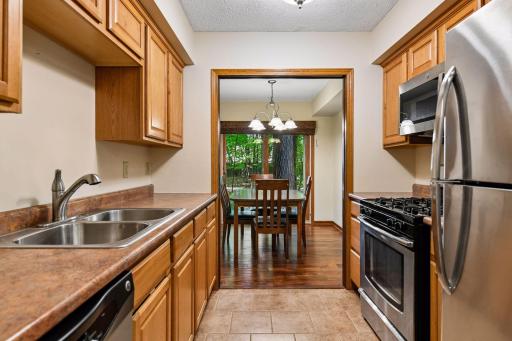 8x8 Main floor Kitchen with Stainless steel appliances including dishwasher and disposal.