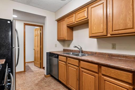 8x8 Main floor Kitchen with Stainless steel appliances including dishwasher and disposal.