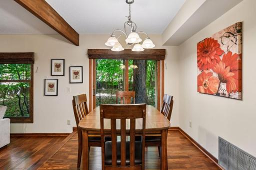 10x8 Main Floor Dining room with North East facing windows leading out to the wooded patio.