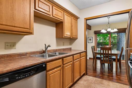 8x8 Main floor Kitchen with Stainless steel appliances including dishwasher and disposal.