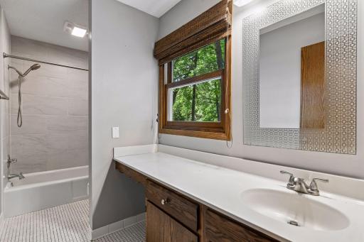 Upper level Full Bathroom with remodeled/updated Shower.
