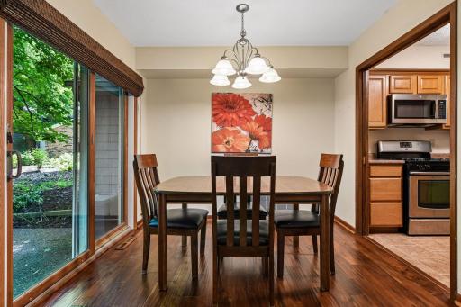 10x8 Main Floor Dining room with North East facing windows leading out to the wooded patio.