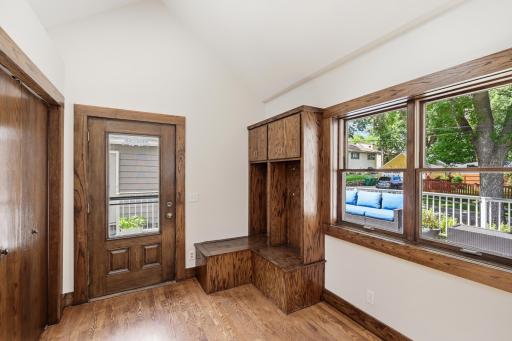The convenient mudroom off of the kitchen offers a built-in boot bench and spacious closet to store all those Minnesota coats and hats.